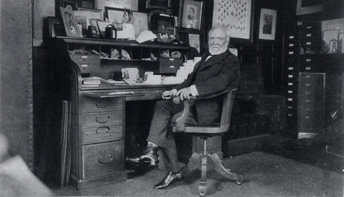 Historic photo of Andrew Carnegie at desk