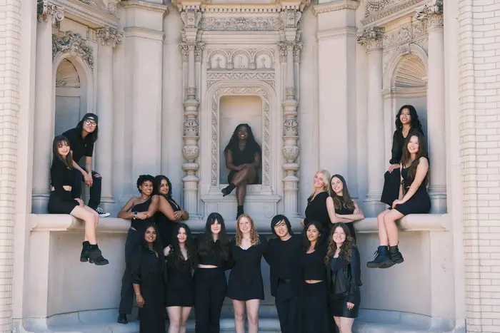 group of girls posing for picture