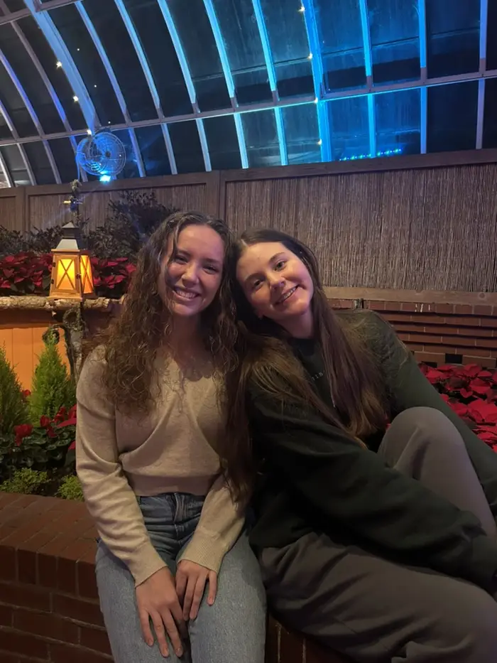 Anna and a friend pose for a photo at Phipps