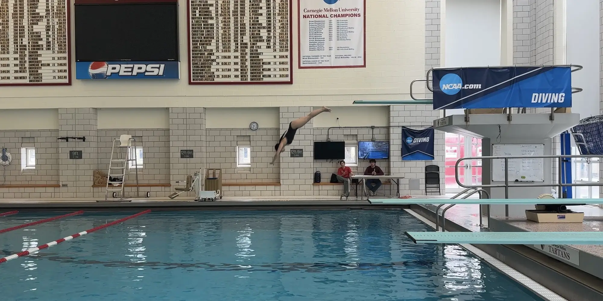 Vivianna dives in the pool during her diving class