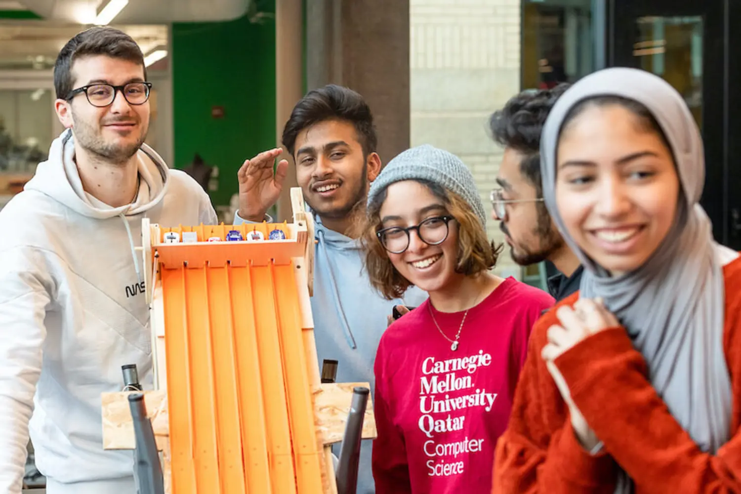 Students participating in CMU's IMPAQT program use a maker space on campus