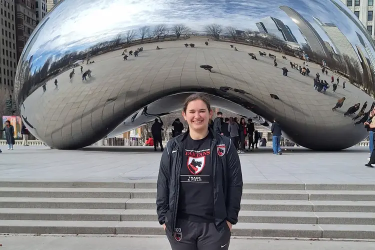 Katie smiling in front of the Bean in Chicago