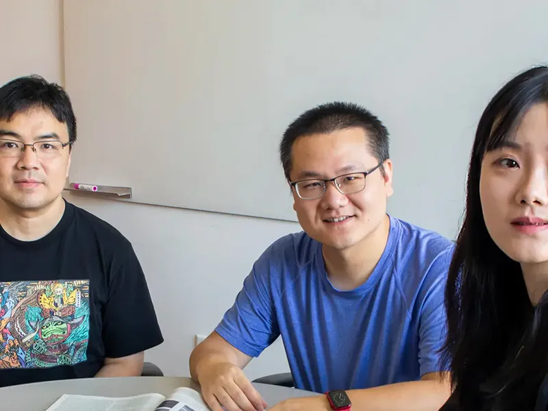 From left to right: Ray and Stephanie Lane Professor of Computational Biology Jian Ma, Yang Zhang, a project scientist Xinyue Lu, a computational biology doctoral student.